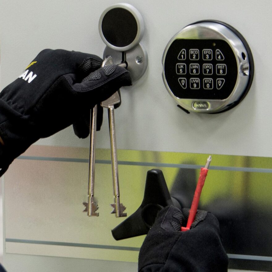 Image of a safe maintenance engineer doing a maintenance check on a safe